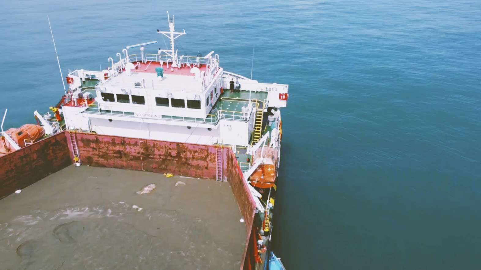 Aerial view of OMS Bromo bulk carrier showing sand cargo loaded in the hold